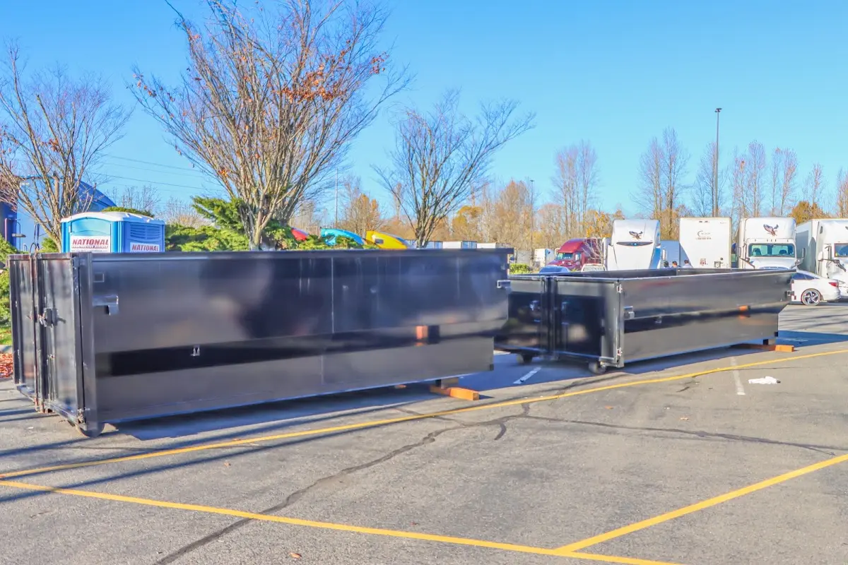 Professional dumpster rental service with roll-off container on residential driveway in Buena Park